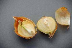 Fresh onion on a gray background photo