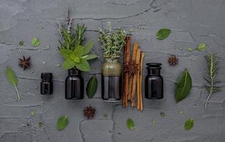 Fresh herbs and spices with bottles photo