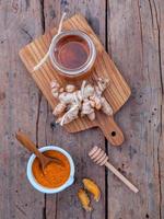 Vertical view of turmeric and honey photo