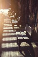 Wooden bench on the street photo