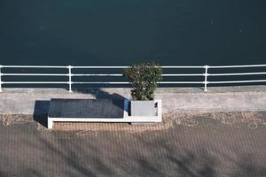 Wooden bench on the street photo