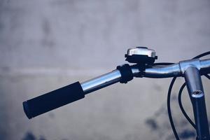 Close up of bicycle handlebar and bell photo