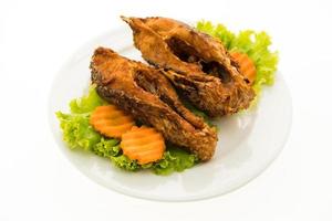 Fried fish on white plate photo