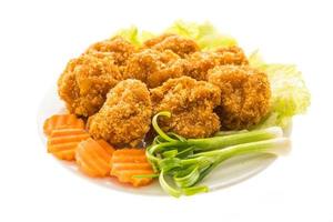 Fried shrimp or prawn cake on a white plate photo