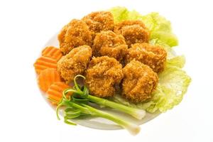 Fried shrimp or prawn cake on a white plate photo