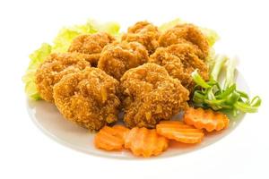 Fried shrimp or prawn cake on a white plate photo