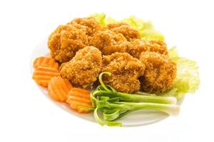 Fried shrimp or prawn cake on a white plate photo