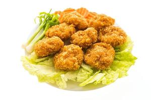 Fried shrimp or prawn cake on a white plate photo