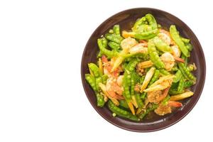 Fried vegetables with shrimp on a plate photo