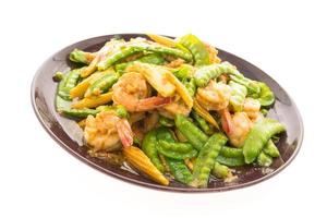 Fried vegetables with shrimp on a plate photo