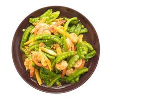 Fried vegetables with shrimp on a plate photo