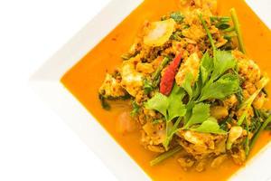 Stir fried crab with curry on white plate photo