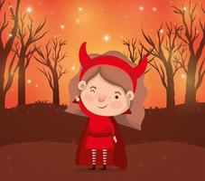 escena de la temporada de halloween con niña en un disfraz de diablo
