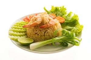 Fried rice with shrimp and prawn on a white plate photo