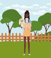 young afro woman lifting cute dog in the field vector