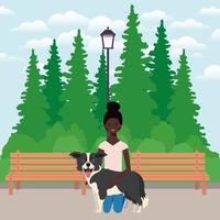 young afro woman lifting cute dog in the field vector