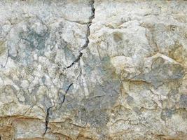 roca o muro de piedra para el fondo o la textura foto