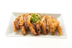 Fried crispy pork on white plate photo