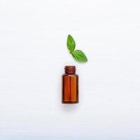 Mint essential oil on white photo