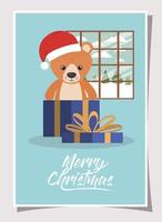 feliz navidad tarjeta con osito de peluche vector