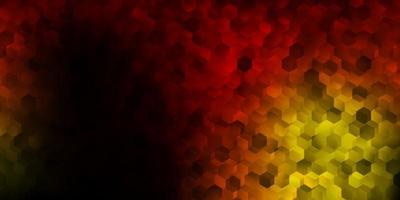 Dark red, yellow vector backdrop with a batch of hexagons.