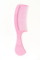 Plastic hair comb isolated on white background photo