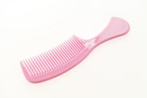 Plastic hair comb isolated on white background photo