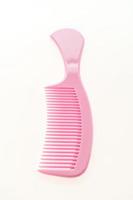 Plastic hair comb isolated on white background photo