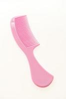Plastic hair comb isolated on white background photo