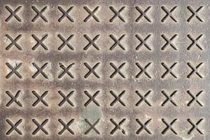 Texture of rusty metal floor plate with bumped pattern photo