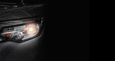 Car headlight and copy space on a dark background photo