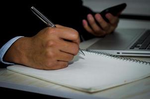 Man taking notes photo