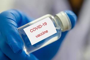 COVID vaccine in a hand photo