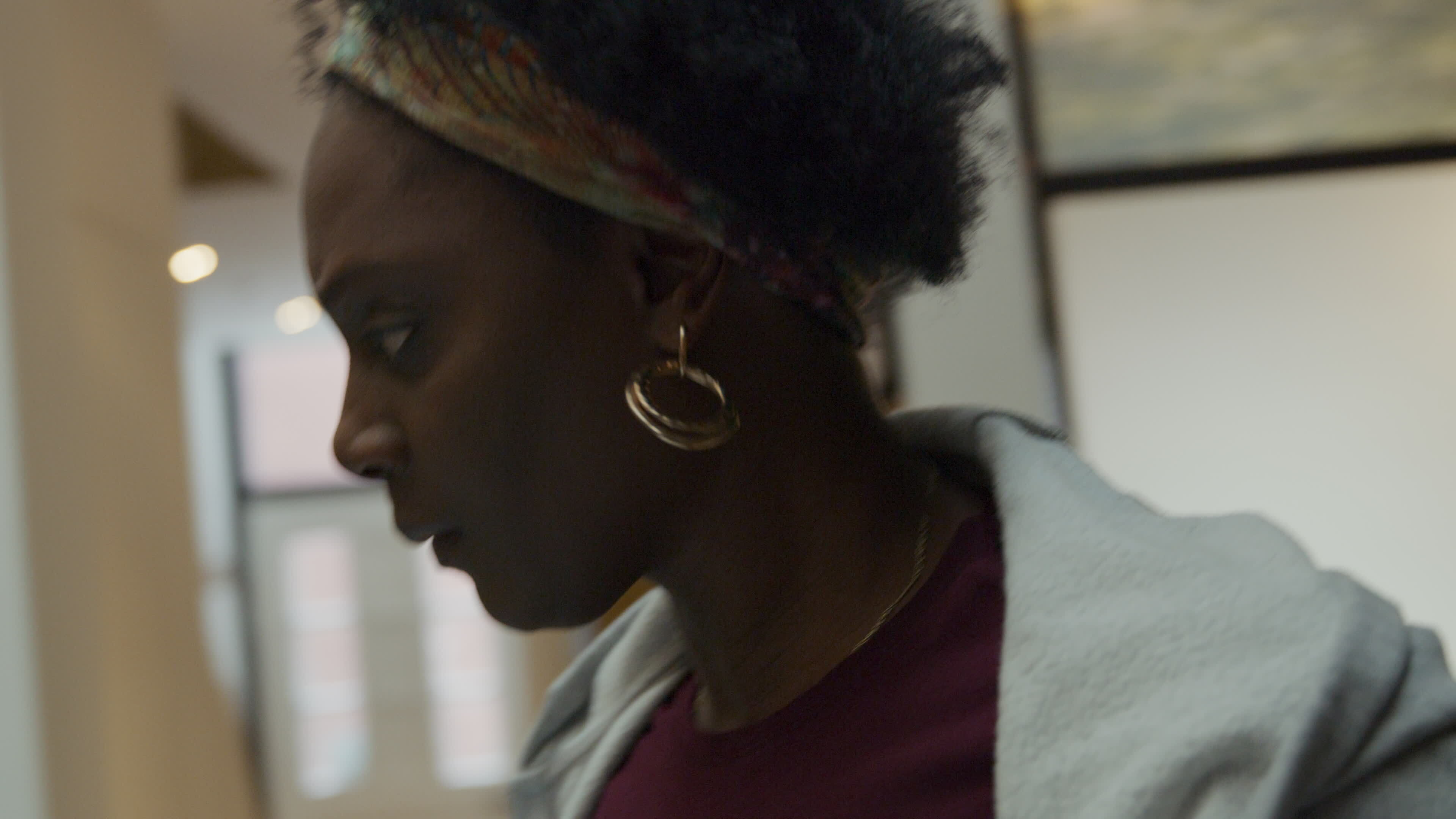 Black mature woman busy searching, looking around picture