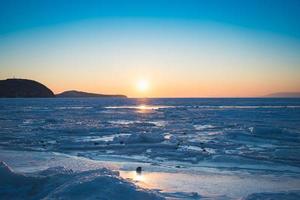 Seascape with sunset view over the icy surface in Vladivostok, Russia photo