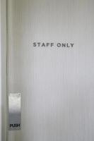 Staff only sign on a wooden door photo