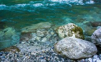 Rocky shore next to a river photo