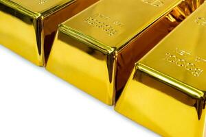 Close up of shiny 1 kg gold bars on a white background photo
