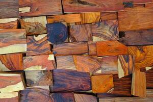 A wall of natural rosewood timber background photo