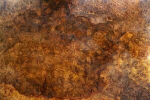 Fondo de textura de madera rayada afzelia burl foto