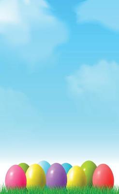 Abstract Easter bokeh background with colorful eggs lying on the grass against the sky background