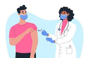A female doctor in a mask and gloves makes a vaccine to a male patient vector