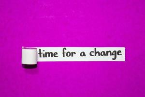 Time for a change text, Inspiration, Motivation and business concept on purple torn paper photo