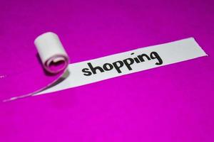 Shopping text, Inspiration, Motivation and business concept on purple torn paper photo