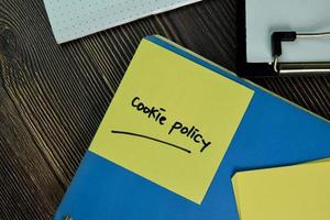 Cookie Policy written on a paperwork isolated on wooden table photo