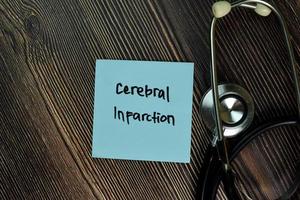 Cerebral Infarction written on sticky note isolated on wooden table photo