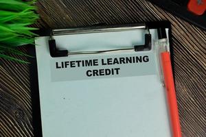 Lifetime Learning Credit written on paperwork isolated on wooden table photo