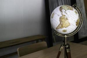 Vintage globe on top of the table photo