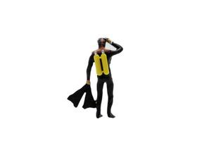 Miniature scuba diver isolated on a white background photo