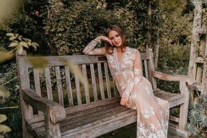 Woman sitting on a park bench photo